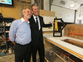 Manitoba's Premier, Brian Pallister (right) with Jeremy Mathison, owner of Western Marble and Tile Ltd. Pallister held a news conference at that location to respond to proposed federal tax changes to small businesses. Friday, September 22, 2017. Chris Procaylo/Winnipeg Sun/Postmedia Network