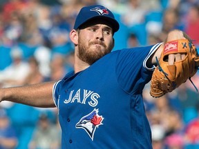 Toronto Blue Jays starting pitcher Joe Biagini throws against the New York Yankees during the first inning of their American League MLB baseball game in Toronto on Saturday, Sept. 23, 2017. THE CANADIAN PRESS/Fred Thornhill