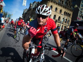 Carl Grimard of the Ottawa Police Service participates in the National Peace Officers’ Memorial Run and the Canadian Police Memorial Ride to Remember at Parliament Hill on Saturday.