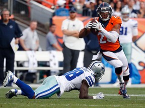 Denver Broncos cornerback Chris Harris (25) intercepts a pass intended for Dallas Cowboys wide receiver Dez Bryant (88) during the second half of an NFL football game, Sunday, Sept. 17, 2017, in Denver. (AP Photo/Jack Dempsey)