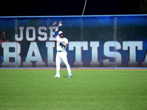 Toronto Blue Jays' Jose Bautista acknowledges the crowd after taking his position in right field in what may be his last home game as a Blue Jay against the New York Yankees during the first inning of a baseball game, Sunday September 24, 2017 in Toronto. (THE CANADIAN PRESS/Jon Blacker)