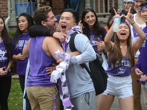 Western University students party on Broughdale Ave during a street party to to celebrate reunion weekend in London, Ontario on Saturday Oct 1, 2016. (MORRIS LAMONT, The London Free Press)