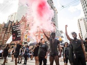 People from the Blacks Lives Matter movement march during the Pride parade in Toronto on June 25, 2017. (Mark Blinch/The Canadian Press)