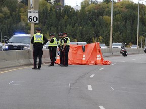 Police investigate a fatal collision in the northbound lane of Groat Road Bridge in Edmonton, AB on Sunday, September 24, 2017. Greg Southam/Postmedia