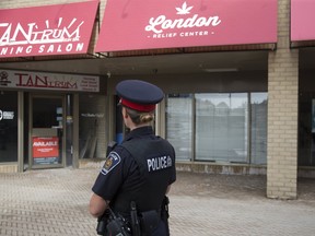 Police arrested five people in a raid on London's newest marijuana dispensary, London Relief Centre, in London, Ont. on Wednesday September 20, 2017. (DEREK RUTTAN, The London Free Press)