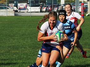 Loyalist Lancers ballcarrier Bailey Meraw breaks the tackle of an Oakville Sheridan Bruins defender during OCAA women's rugby Sevens action last weekend in Kingston. (Loyalist Lancers Athletics photo)