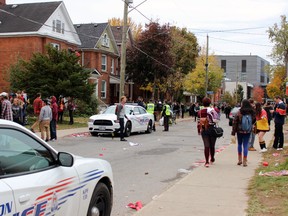Kingston Police patrol Aberdeen Street in Kingston  in the early afternoon on Saturday, Oct. 24, 2015. (Steph Crosier/The Whig-Standard/Postmedia Network)