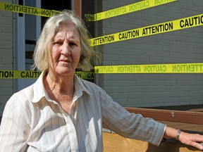 Florence Grimshaw stands in front of the deck in question at her home in Amherstview. (Steph Crosier/The Whig-Standard/Postmedia Network)