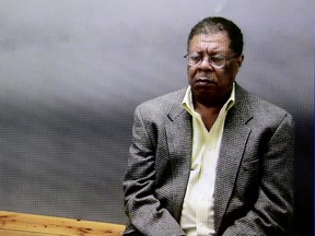 Stuart Dunnings III, shown at the Ingham County jail on video, appears for an arraignment at a courtroom in Lansing, Mich., on March 14, 2016. Dunnings, who had been the top law enforcer in Michigan's capital area for nearly 20 years, was released from prison after serving 10 months for misconduct in office and soliciting a prostitute. (Dave Wasinger/Lansing State Journal via AP)