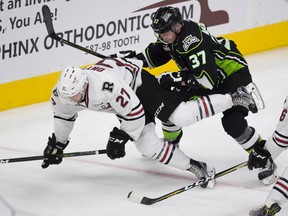 Edmonton Oil Kings Conner McDonald pushes Red Deer Rebels Jared Dmytriw to the ice during third period WHL action on Sunday September 24, 2017 in Edmonton.