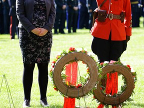 Alberta Justice Minister and Solicitor General Kathleen Ganley, left, and RCMP Sgt. Leilani Collins pay tribute at the Alberta Police and Peace Officers' Memorial Day on Sunday, Sept. 24, 2017. The public ceremony was held on the Alberta legislature grounds to honour and remember the 100 men and women who gave their lives to keep Albertans safe. Larry Wong