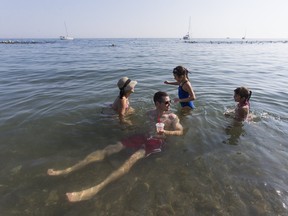 Dexter Greenstein and his wife, Young Shin, and daughters, Mina, 7 and Louina, 5, enjoy the water in the Beach neighbourhood on Sunday, September 24, 2017. Ernest Doroszuk/Toronto Sun