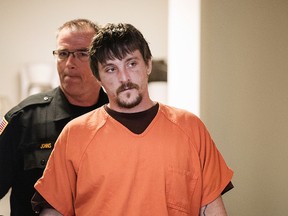 In this April 25, 2017, file photo, Joseph Jakubowski is escorted into a room at the Rock County Courthouse for his preliminary hearing in Janesville, Wis. Jakubowski, who is accused of stealing an arsenal of firearms from a southern Wisconsin gun shop and sending an anti-government manifesto to President Donald Trump, is set to go on trial in federal court in Madison beginning Monday, Sept. 25, 2017. (Angela Major/The Janesville Gazette via AP, File)