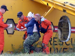 Bruce Bell/The Intelligencer
A victim of the simulated air crash is helped from a Buffalo aircraft.