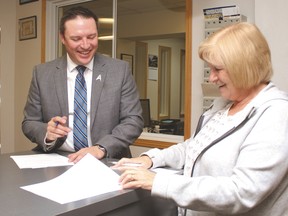 Georgia-Lee DeBolt submits Sept. 18 her nomination forms for another term as a Town councilor to Kim Fath, the Town’s administrator.