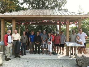 Members with the Bluewater Trails Committee and others alongside the Howard Watson Nature Trail in Sarnia recently celebrate a federal grant coming through. The $110,000 grant helped fund 15 kilometres worth of trail widening last year. (Submitted)