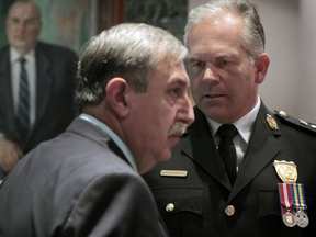 Police board chair Coun. Eli El-Chantiry, left, asked Chief Charles Bordeleau, right, at Monday’s police services board meeting whether the force has received any direction from the attorney general on what to do about the illegal pot shops that continue to exist in the cityTONY CALDWELL / POSTMEDIA