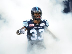 Toronto Argonauts defensive back Alden Darby is covered by artificial smoke prior to CFL action against the Montreal Alouettes in Toronto on Sept. 23, 2017. (THE CANADIAN PRESS/Jon Blacker)
