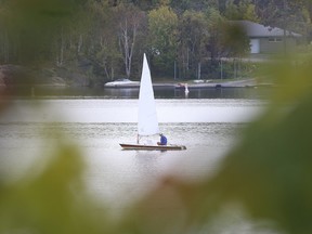A sailor makes his way across Ramsey Lake in Sudbury, Ont. on Monday September 25, 2017. Temperatures will cool to more seasonable temperatures by week's end. Gino Donato/Sudbury Star/Postmedia Network