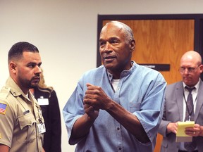 In this July 20, 2017 file photo, O.J. Simpson reacts after learning he was granted parole at Lovelock Correctional Center in Lovelock, Nev. (Jason Bean/The Reno Gazette-Journal via AP, Pool, File)