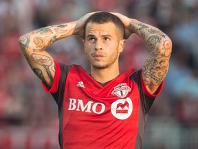 Toronto FC forward Sebastian Giovinco reacts after teammate Jozy Altidore missed a goal scoring opportunity against the Portland Timbers during MLS action in Toronto on Aug. 12, 2017. (THE CANADIAN PRESS/Chris Young)