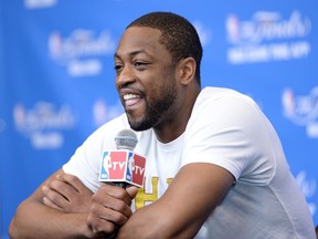 This file photo taken on June 6, 2014 shows Dwyane Wade formally of the Miami Heat speaking at a media availability at the San Antonio Spurs Practice Facility in San Antonio, Texas. (AFP)