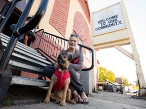Rebecca Hewett sits with her dog Loki as she waits to see a vet at the Mustard Seed Church, 10635 96 St., in Edmonton Tuesday Sept. 26, 2017. Hewett credits Loki with helping her end a 15 year heroin addiction. David Bloom / Postmedia