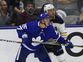 Toronto Maple Leafs forward Miro Aaltonen jostles with Buffalo Sabres defenceman Matt Tennyson during NHL pre-season action at Ricoh Coliseum in Toronto on Sept. 22, 2017. (Jack Boland/Toronto Sun/Postmedia Network)