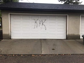The garage door of former Edmonton Eskimos player Craig Ellis was vandalized with a racist message Thursday. (Supplied by Brittani Ellis)