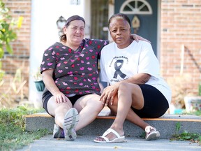 Elizabeth Davis, right, and her friend Caroline Suotala outside of her Louis Street home in Sudbury, Ont. on Tuesday September 26, 2017. Davis was attacked behind the YMCA while the two friends were attending quilting workshop. Gino Donato/Sudbury