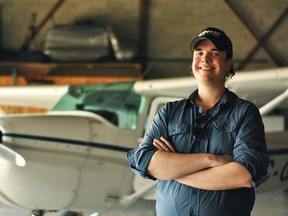 Darcy Cameron is shown in front of a Cessna 172 plane inside a hangar at the Chatham-Kent Municipal Airport. The Tilbury man has started a group called Sky Warriors and intends to take video footage over Highway 401 from the sky.