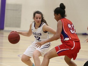 Tayna Fairwell of the Macdonald Cartier Pantheres keeps in close check with Mireille Di Maio of the Lo Ellen Knights during senior girls high school basketball action in Sudbury, Ont. on Tuesday September 26, 2017. Gino Donato/Sudbury Star/Postmedia Network