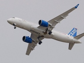 The Bombardier CS 300 performs its demonstration flight during the Paris Air Show, at Le Bourget airport, north of Paris on June 15, 2015. (THE CANADIAN PRESS/AP, Francois Mori)