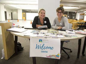Mental health workers Crystal McKellar (left) and Jessica Carswell operate an outreach program on the second floor of the London Central Library in London. (DEREK RUTTAN, The London Free Press)