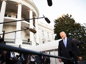 President Donald Trump speaks to the media as he walks from Marine One to the White House in Washington, Wednesday, Sept. 27, 2017, as he returns from Indianapolis. (AP Photo/Carolyn Kaster)