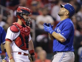 Toronto Blue Jays' Kendrys Morales, right, looks skyward as he crosses home plate after hitting a three-run home run, next to St. Louis Cardinals catcher Eric Fryer during the fifth inning April 27, 2017, in St. Louis. (AP)