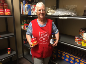 Volunteer Pauline Thompson helping families in need receive food for Thanksgiving.