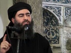 This file image made from video posted on a militant website July 5, 2014, purports to show the leader of the Islamic State group, Abu Bakr al-Baghdadi, delivering a sermon at a mosque in Iraq during his first public appearance. The Islamic State group released on Thursday, Sept. 28, 2017 a purported audio recording from top leader al-Baghdadi. (Militant video via AP, File)