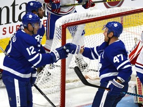 Toronto Maple Leafs' Patrick Marleau, left, and Leo Komarov, of Finland, celebrate Marleau's goal against the Montreal Canadiens during the second period of their NHL preseason hockey game in Toronto on Monday September 25, 2017. (THE CANADIAN PRESS/Jon Blacker)