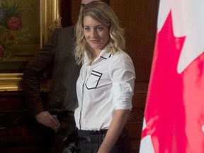Minister of Canadian Heritage Melanie Joly makes her way to speak with reporters after outlining the government's vision for cultural and creative industries in a digital world in Ottawa, Thursday, Sept. 28, 2017. THE CANADIAN PRESS/Adrian Wyld