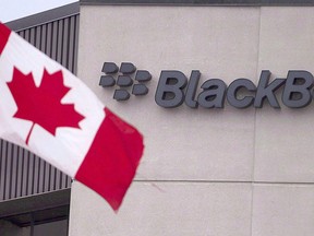 A Canadian flag flies at BlackBerry's headquarters in Waterloo, Ont. in this July 9, 2013 photo. THE CANADIAN PRESS/Geoff Robins