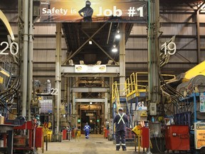 Safety reminders hang over a heavy hauler maintenance shop at Suncor Energy's base plant, located north of Fort McMurray, Alta., on Wednesday September 27, 2017. Vincent McDermott/Fort McMurray Today/Postmedia Network