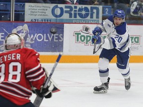 Shane Bulitka, right, of the Sudbury Wolves, fires a puck at Kyle Keyser, of the Oshawa Generals, during OHL action at Sudbury Community Arena in Sudbury, Ont. on Friday, September 22, 2017. John Lappa/Sudbury Star/Postmedia Network