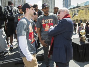 Larry Tanenbaum, chairman of Maple Leaf Sports & Entertainmeny, chats with Raptors 905 head coach Jerry Stackhouse and GM Dan Tolzman as the team celebrates winning the 2017 NBA D-League championship at Celebration Square in Mississauga on April 28, 2017. (Ernest Doroszuk/Toronto Sun/Postmedia Network)