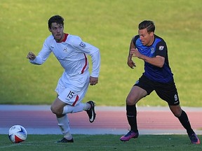 FC Edmonton midfielder Ben Fisk, right, chases San Francisco Deltas midfielder Maxim Tissot in North American Soccer League play in San Francisco on Saturday, Sept. 23, 2017.