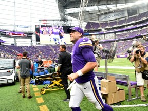 Case Keenum of the Minnesota Vikings smiles as he jogs off the field after the game against the Tampa Bay Buccaneers on Sept. 24, 2017 at U.S. Bank Stadium. (Hannah Foslien/Getty Images)