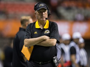 Hamilton Tiger-Cats' head coach June Jones stands on the sideline before a CFL football game against the B.C. Lions in Vancouver on Sept. 22, 2017. (THE CANADIAN PRESS/Darryl Dyck)