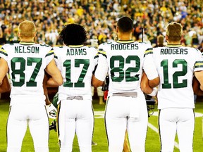 Green Bay Packers players link arms during the singing of the national anthem before the game against the Chicago Bears at Lambeau Field on September 28, 2017 in Green Bay, Wisconsin. (Photo by Stacy Revere/Getty Images)