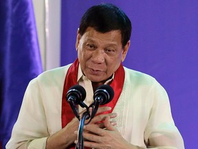 In this Aug. 2, 2017 file photo, Philippine President Rodrigo Duterte speaks during the 113th Founding Anniversary of the Bureau of Internal Revenue in metropolitan Manila. The Philippine president says he became a local millionaire at a young age due to inheritance and reiterated he has no unexplained wealth as alleged by his leading critic, who questioned his claim that he was born into an impoverished family. (AP Photo/Aaron Favila, File)