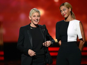 Ellen DeGeneres (L) and singer Beyonce speak onstage at the 55th Annual GRAMMY Awards at Staples Center on February 10, 2013 in Los Angeles, California. (Photo by Kevork Djansezian/Getty Images)